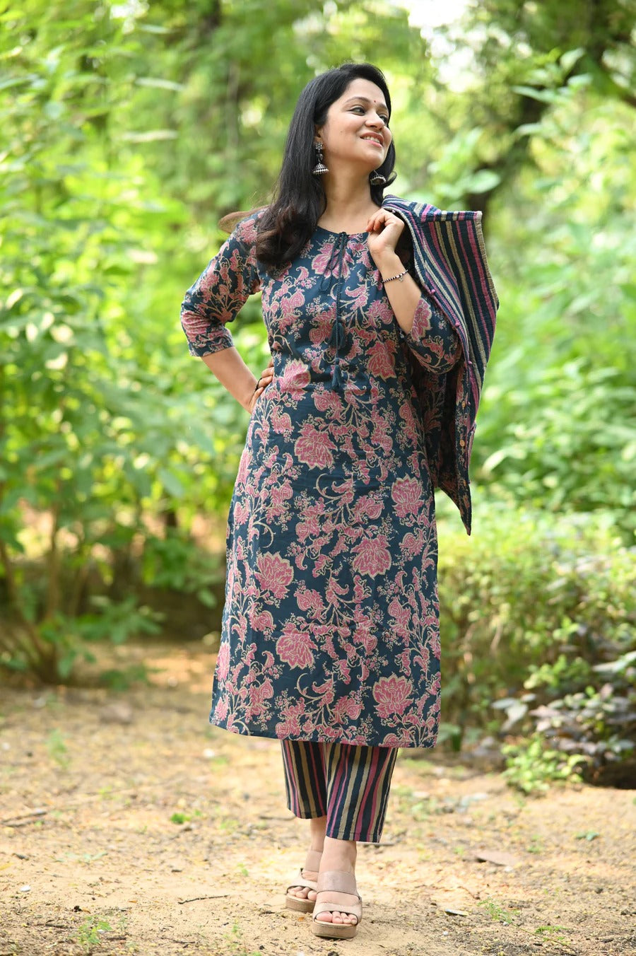 Elevate your ethnic style with this elegant heavy suit set, adorned with intricate hand embroidery and mill prints.